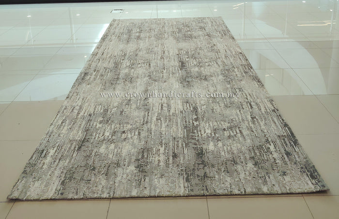 Large grey area rug with textured distressed abstract pattern, rectangular