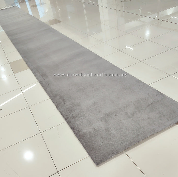 Grey long runner rug with subtle mottled finish and low, soft pile.