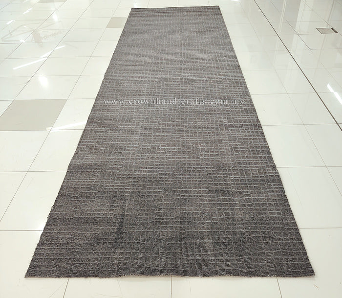 Dark grey extra-long area rug full view with subtle geometric grid texture