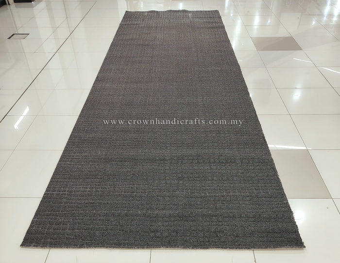 Dark grey extra-long area rug with subtle geometric woven pattern and textured surface