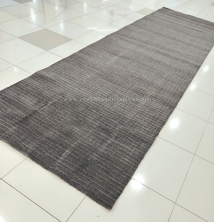 Dark grey extra-long area rug with tightly woven grid texture