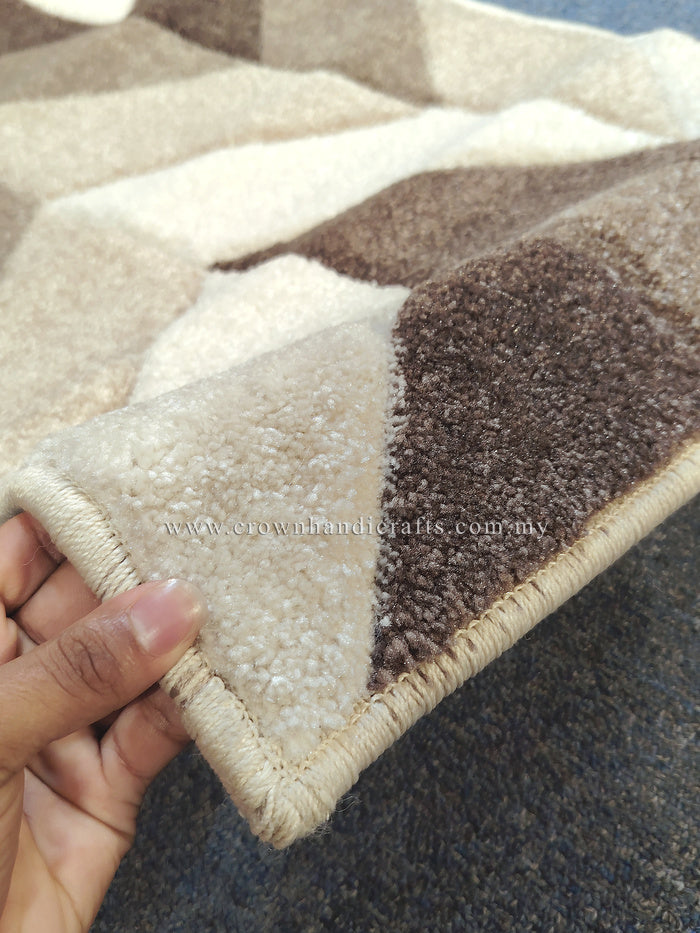 Bone and brown runner rug with geometric patchwork pattern and stitched border.